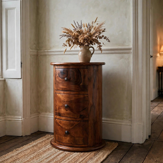 Solid mango wood 3 drawer drum chest with knobs in a bedroom setting