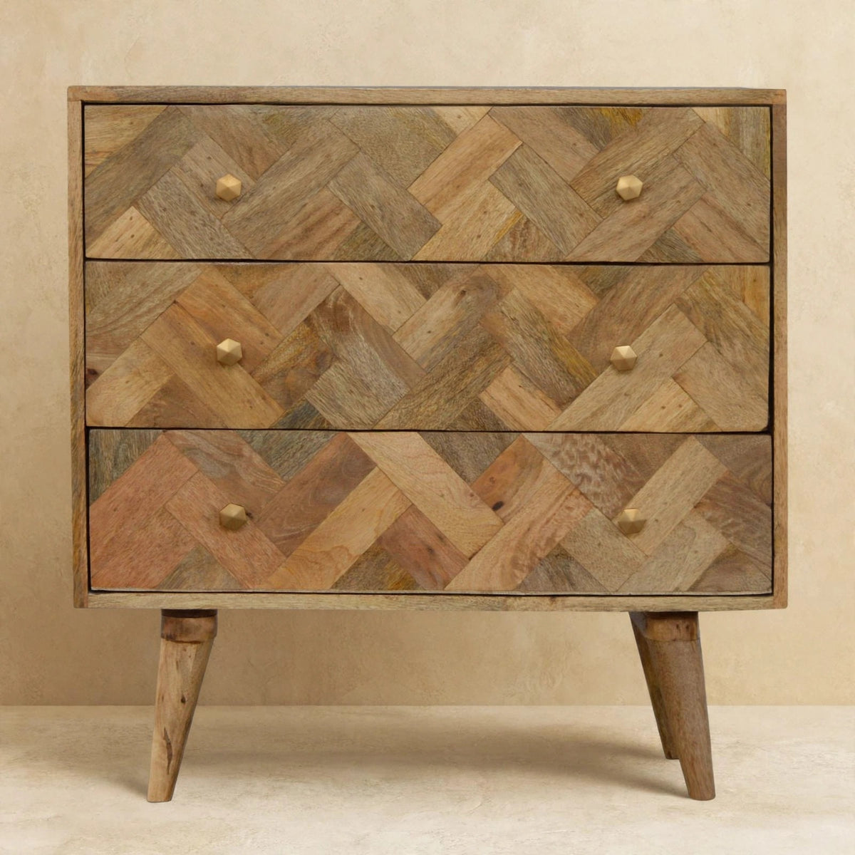 Front view of the 3 drawer patchwork chest with brass hexagon knobs
