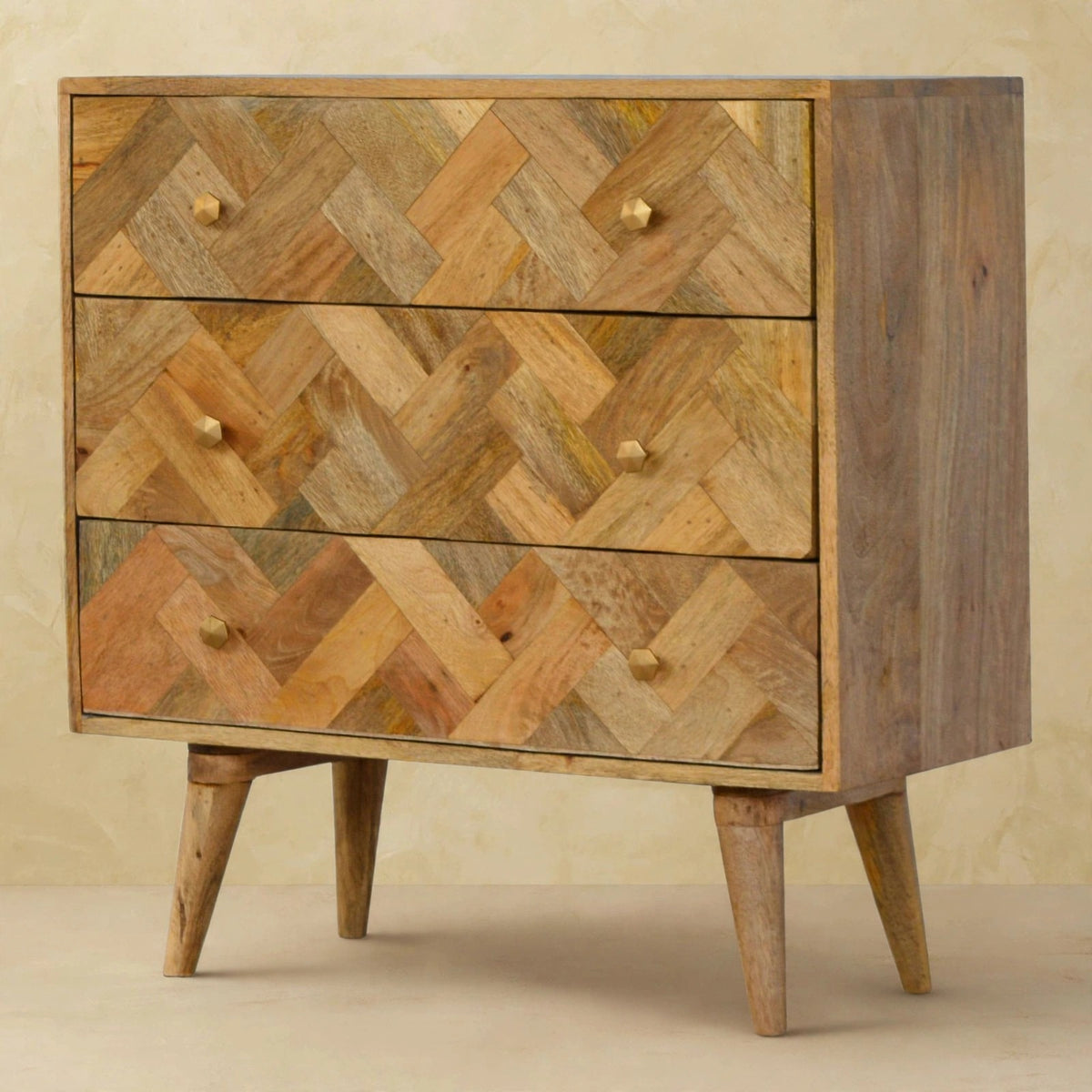 Mango wood patchwork chest on Nordic style legs in a styled interior