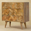 Mango wood patchwork chest on Nordic style legs in a styled interior