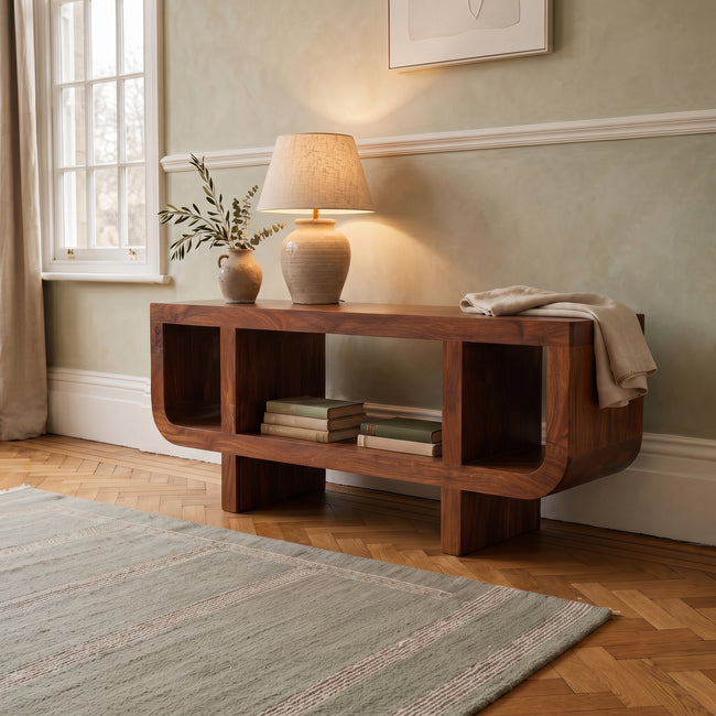 Orion curved chestnut media unit in solid mango wood with open shelves and block legs