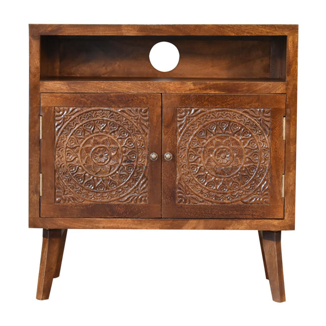 Front view of the Tova mango wood cabinet with patterned door fronts and brass knobs
