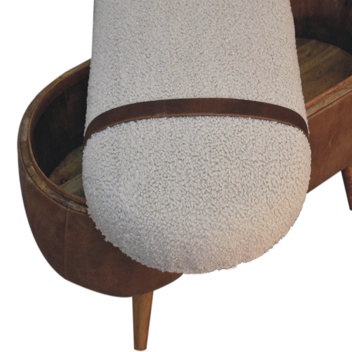 Close-up of the textured cotton boucle seat on the tan bench