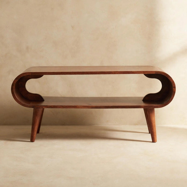 Angled view of the Amaya coffee table showing its Nordic-style legs and smooth round edges