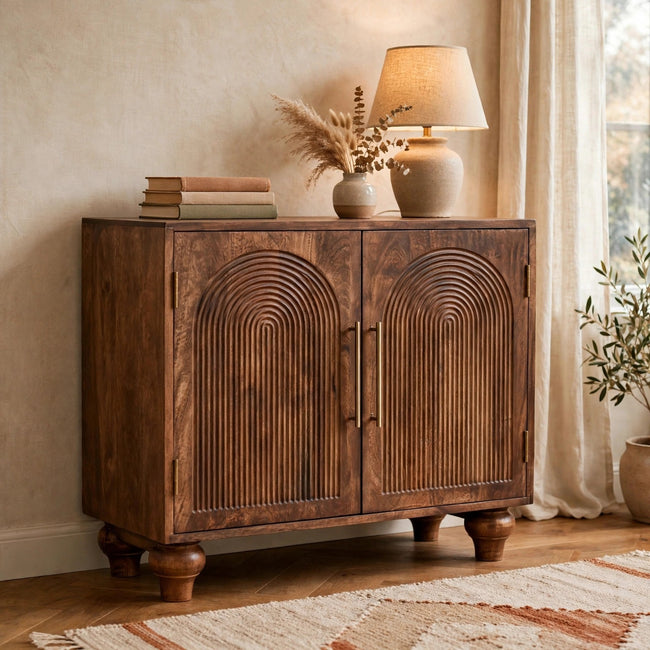 Arco Groove solid mango wood sideboard with carved arc doors in a living room