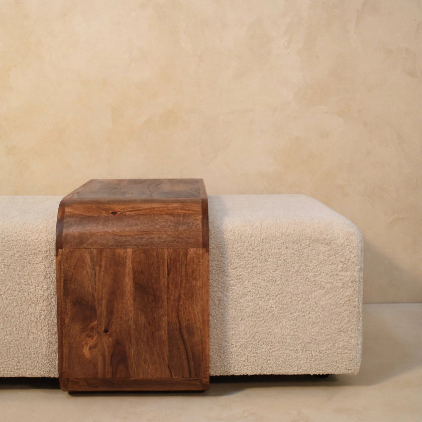 Angled view of the Arden Bench Duo showing the curved mango wood table