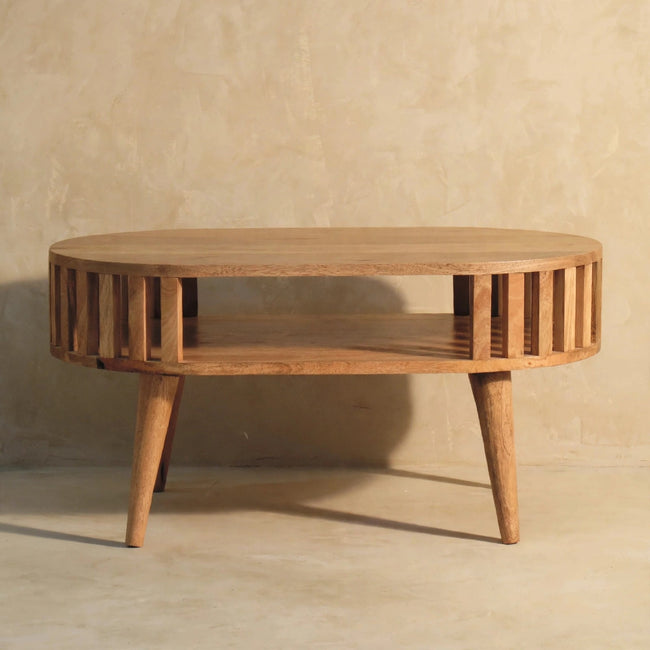 Ariella coffee table in front of a sofa, showing its open Japanese-inspired design