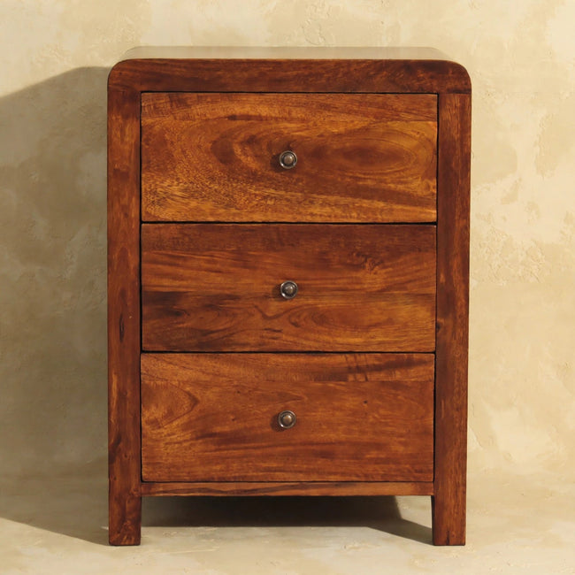 Front view of the Aspen bedside table showing three drawers with brass knobs