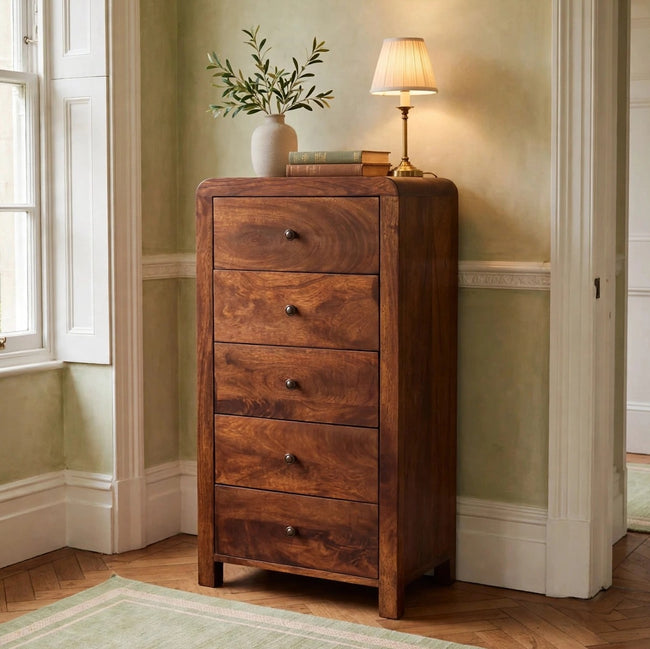 Aspen solid mango wood tallboy with a chestnut-toned finish in a bedroom setting