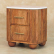 Close view of the marble top and fluted drawers of the Aurora bedside table