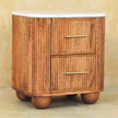 Brass drawer handles on the Aurora mango wood bedside table