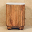 Aurora marble bedside table styled with decor in a bedroom