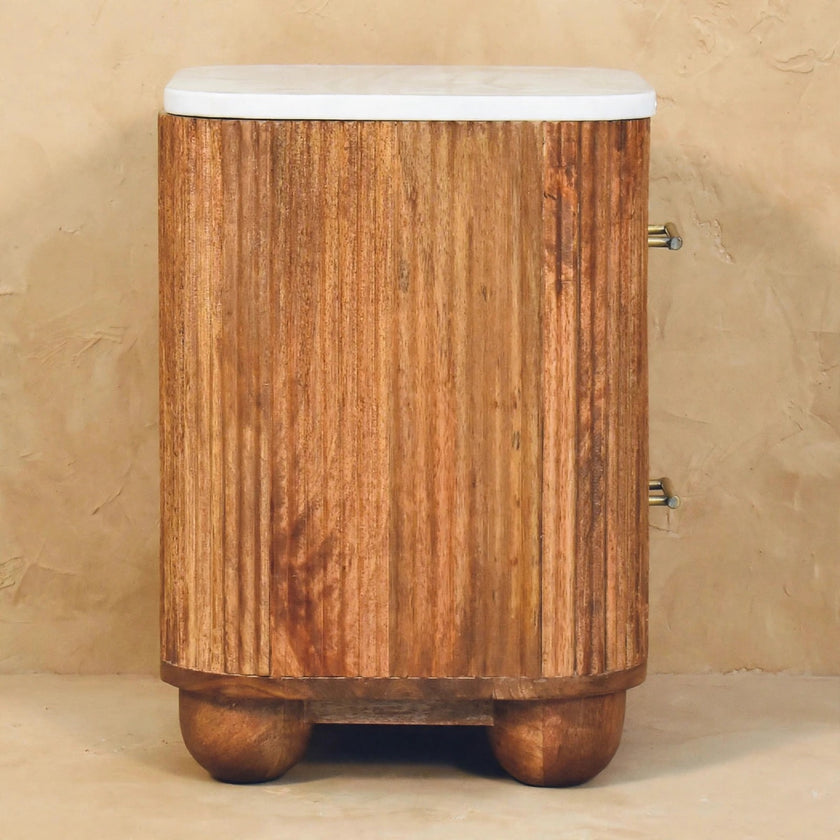 Aurora marble bedside table styled with decor in a bedroom