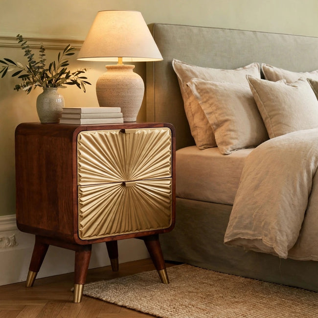 Avora chestnut mango wood nightstand with brass sunburst embossing, styled in a bedroom