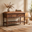 Mango wood storage bench with bamboo-style carvings and a mocha leather cushion in a room setting
