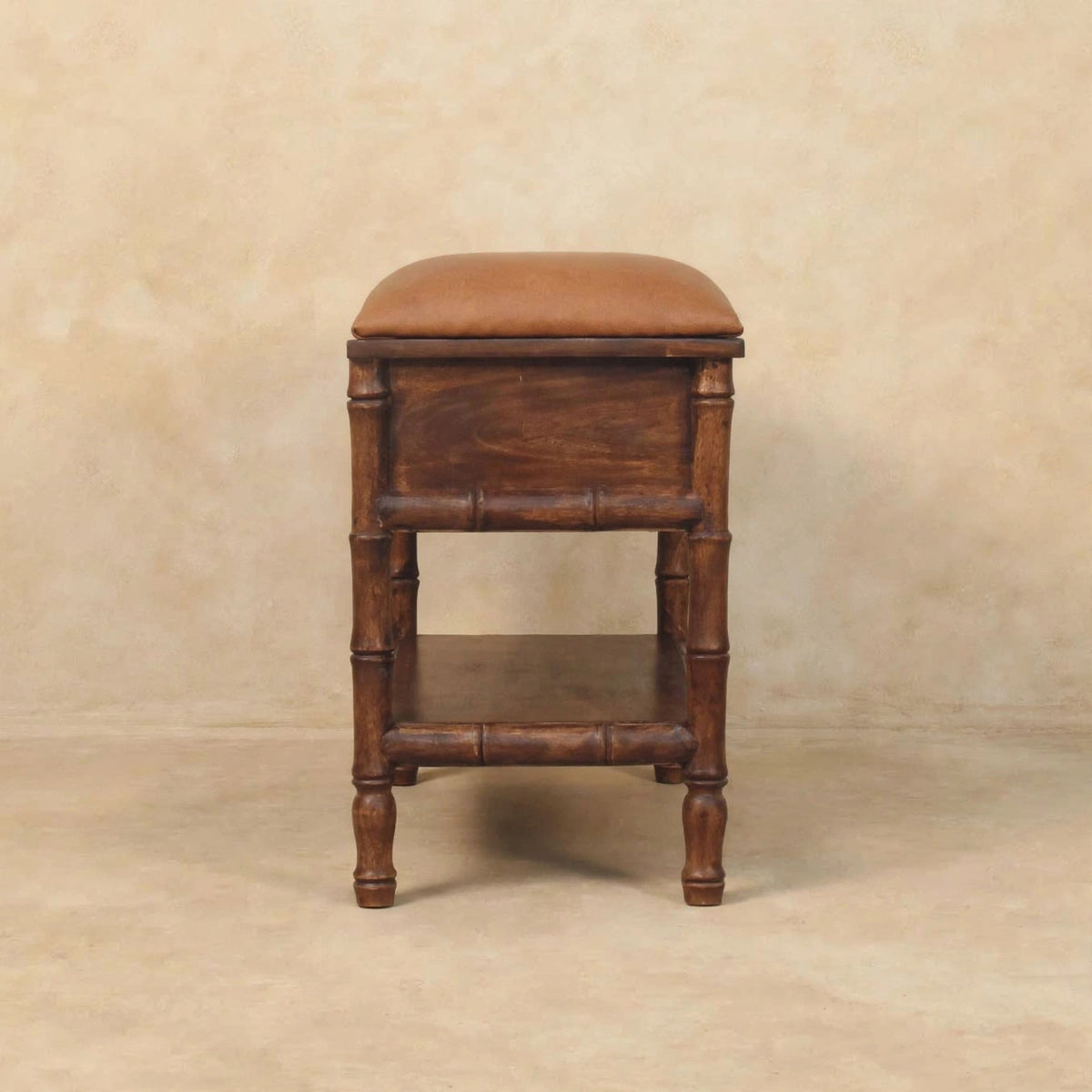 Bamboo carved storage bench placed in an entryway-style room