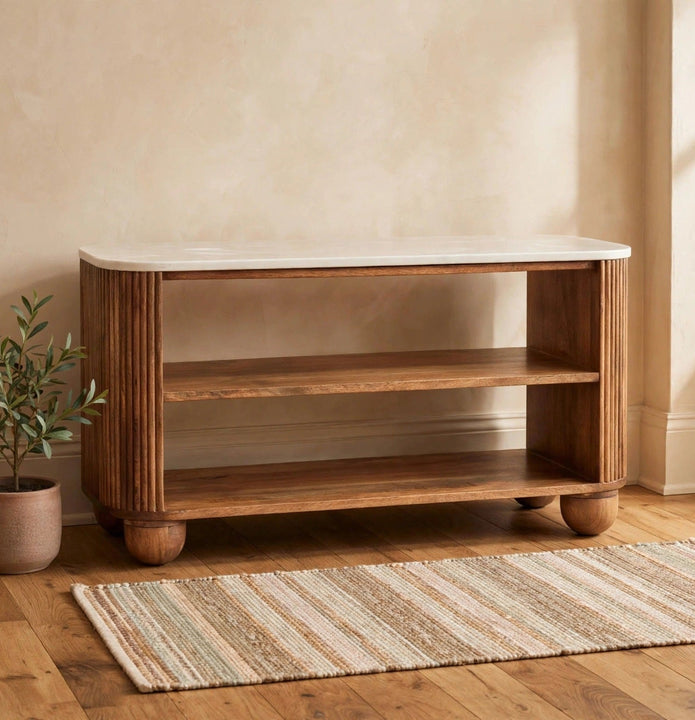 Marble shoe bench with a solid mango wood base in a styled hallway