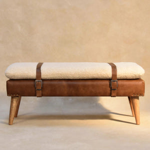 Front view of a cream bouclé upholstered bench in a room setting