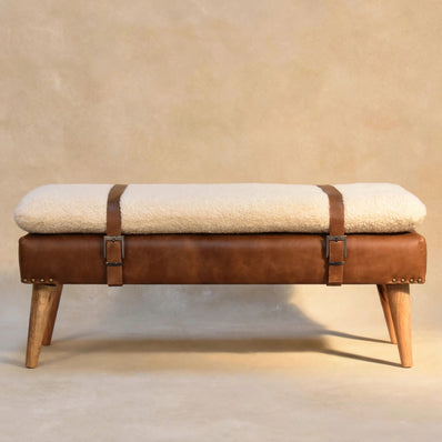 Front view of a cream bouclé upholstered bench in a room setting
