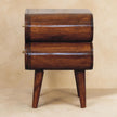 Warm chestnut finish of the solid mango wood bedside table in a room setting