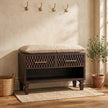 Solid mango wood shoe storage bench with carved drawer fronts in a hallway setting