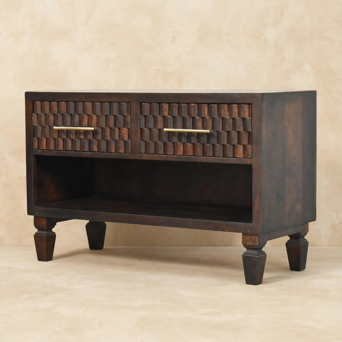 Close view of the carved mango wood drawer fronts on the shoe storage bench