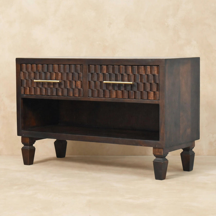 Close view of the carved mango wood drawer fronts on the shoe storage bench