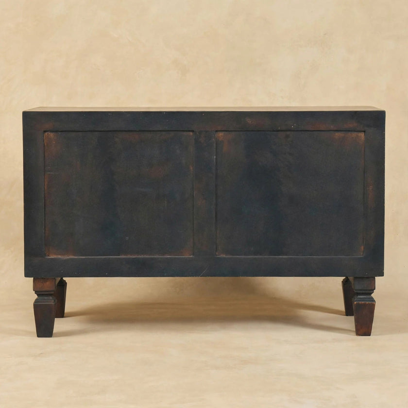 Side view of the Velvet Mocha mango wood shoe storage bench in a room