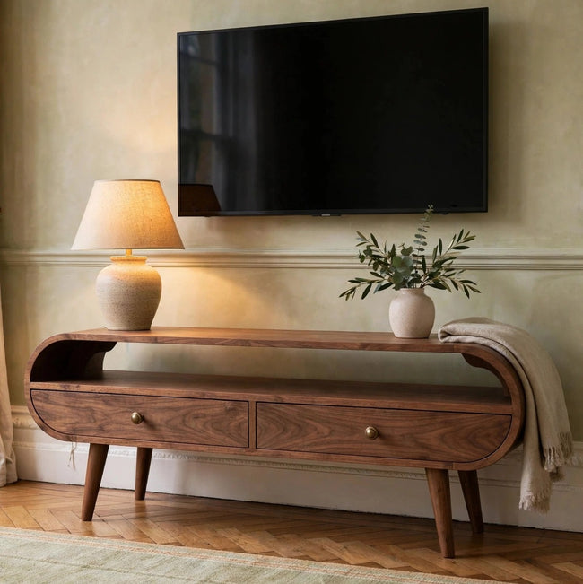California walnut circular TV stand with two drawers in a living room setting