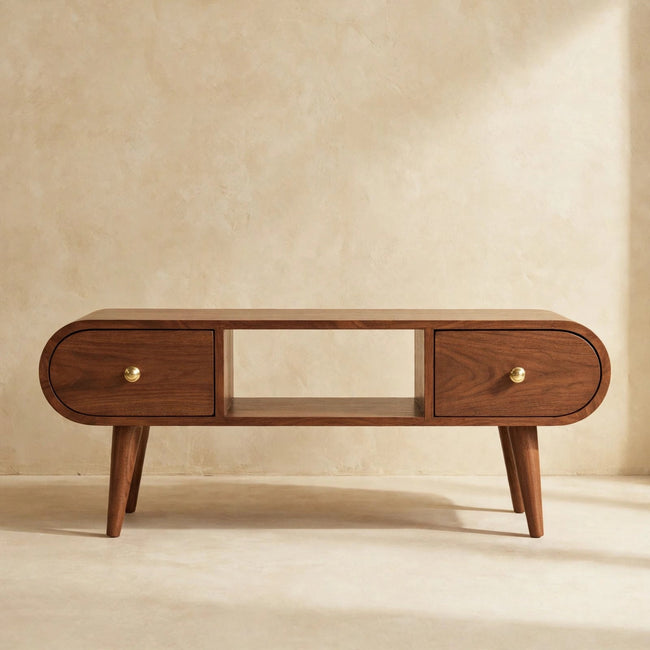 Round-edged walnut finish TV unit with two small drawers and knobs in a styled room