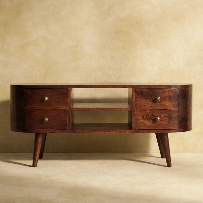 Solid mango wood media unit with Nordic-style legs in a room setting