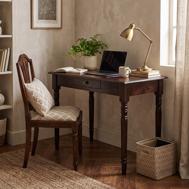 California walnut writing desk with one drawer set up in a room