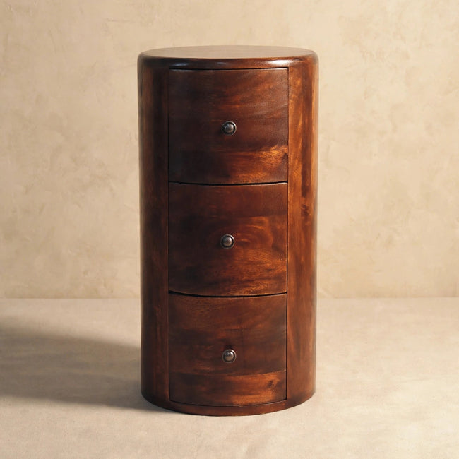 Chestnut mango wood drum chest used as an end table beside other furniture