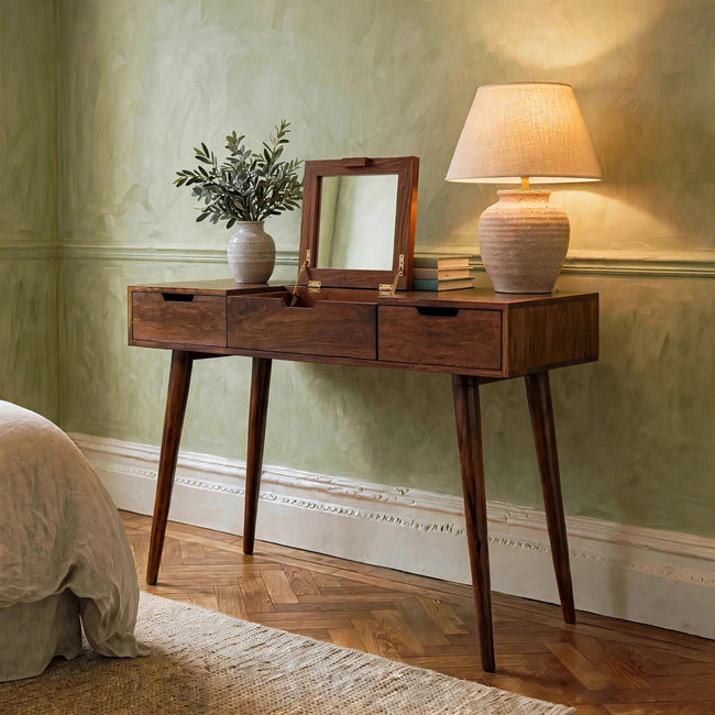 Chestnut mango wood dressing table with foldable mirror, shown in a bedroom setting