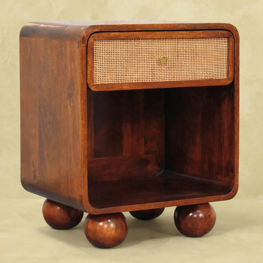 Bedside table with a woven drawer front in a room setting