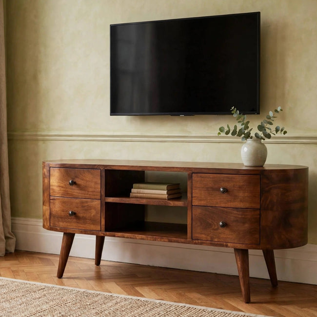 Chestnut solid mango wood TV unit with rounded edges and four drawers in a living room