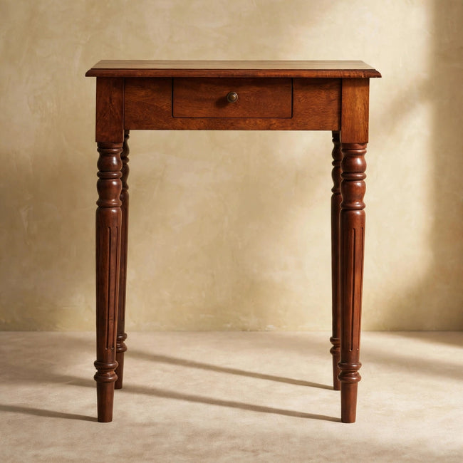 Front view of the chestnut writing desk showing the drawer and brass knob