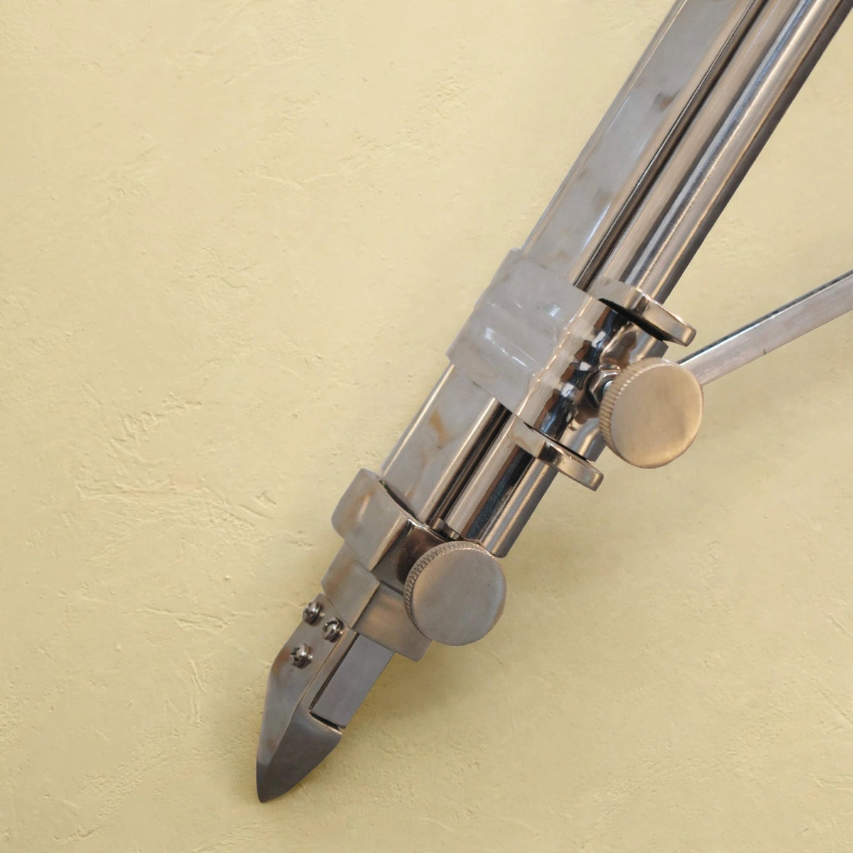 Room scene with the chrome tripod lamp and its neutral shade