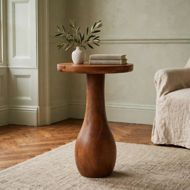 Curved base side table in Amber Oak mango wood styled in a living room
