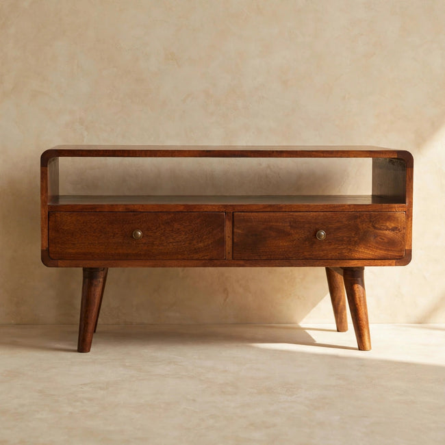 Chestnut media unit with two drawers and shiny knobs, styled with decor