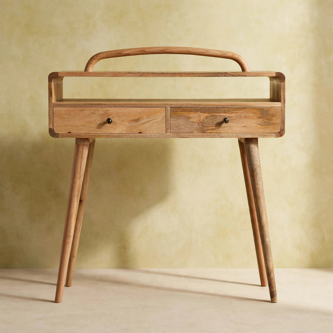 Curved console table with shiny drawer knobs shown in a room
