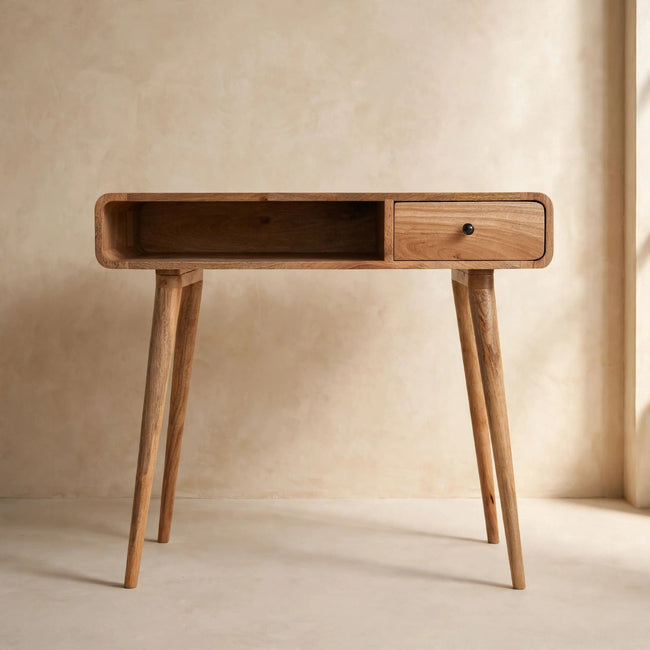Writing desk with an oak-ish finish and Nordic-style legs set up as a study workspace