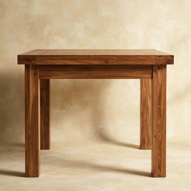 Mango wood dining table with a natural oak-ish finish shown in a room setting