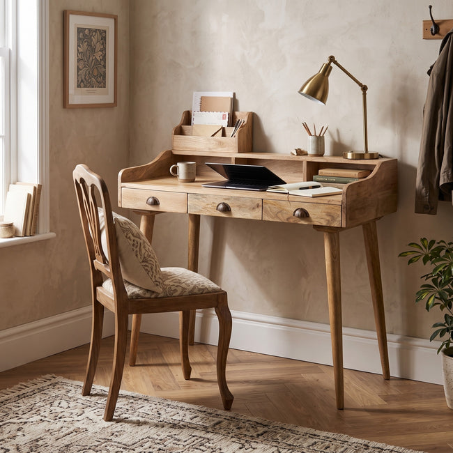 Solid mango wood writing desk with gallery back and drawers, shown in a room setting