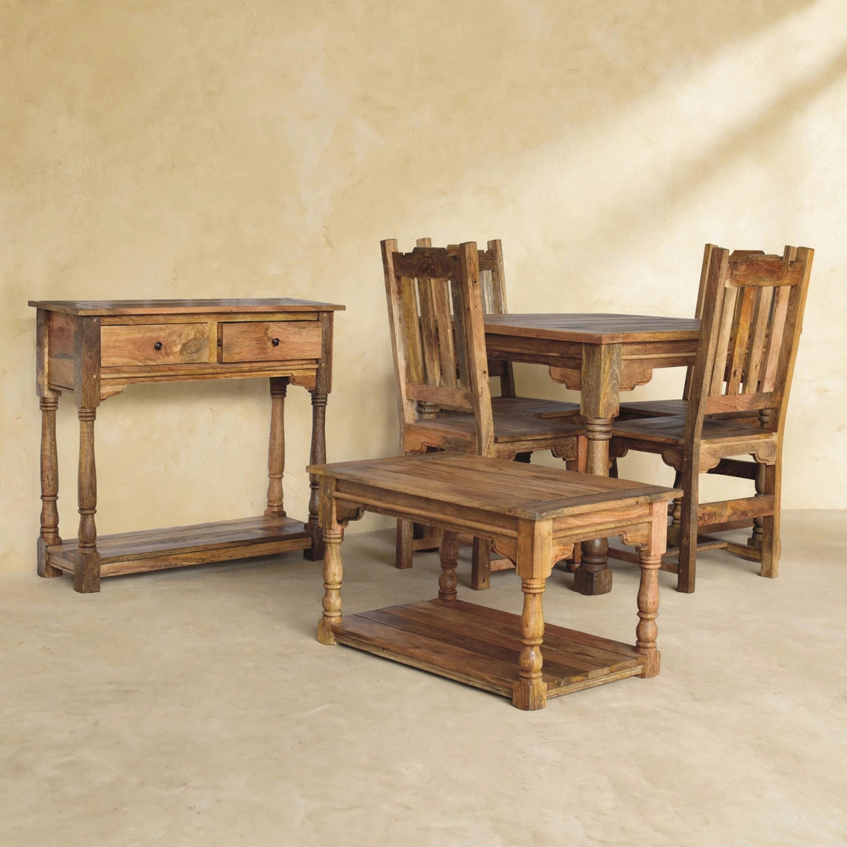 Mango wood dining table set with four chairs arranged around the table in a room setting