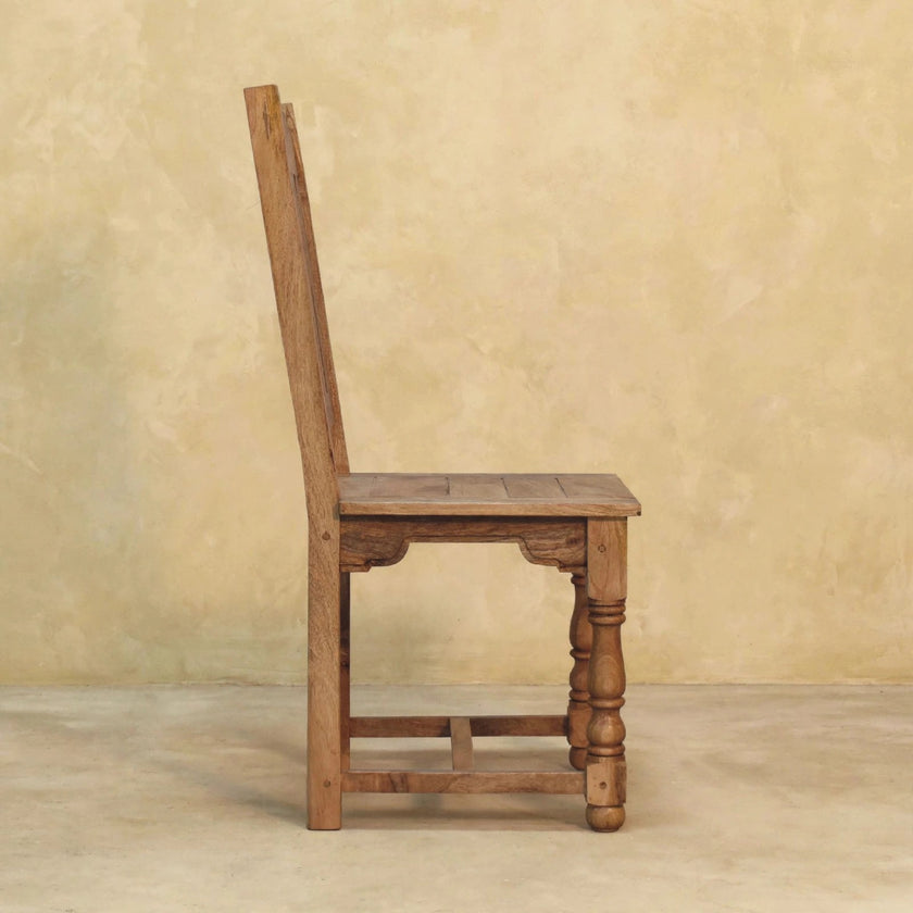 Four-chair mango wood dining set seen from a different angle in the room