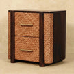 Woven rattan panels and brass handles on the Havana Canefront Drawers in a bedroom