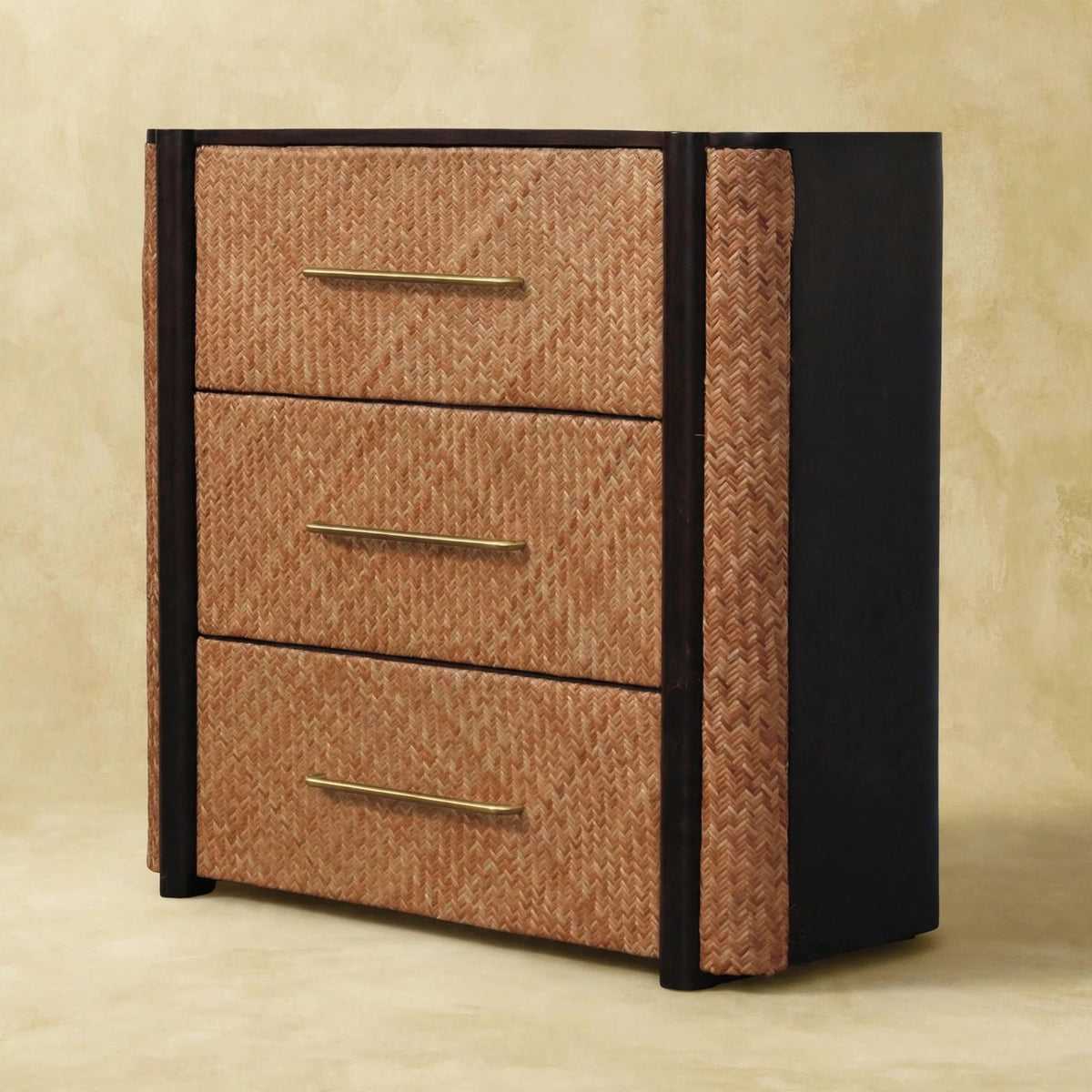 Close room view of the chest showing handwoven rattan drawer fronts