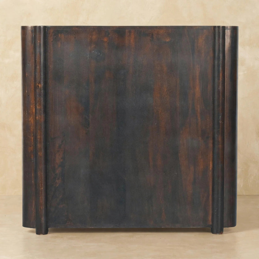 Rattan and mango wood 3 drawer chest used as a feature piece in a styled room