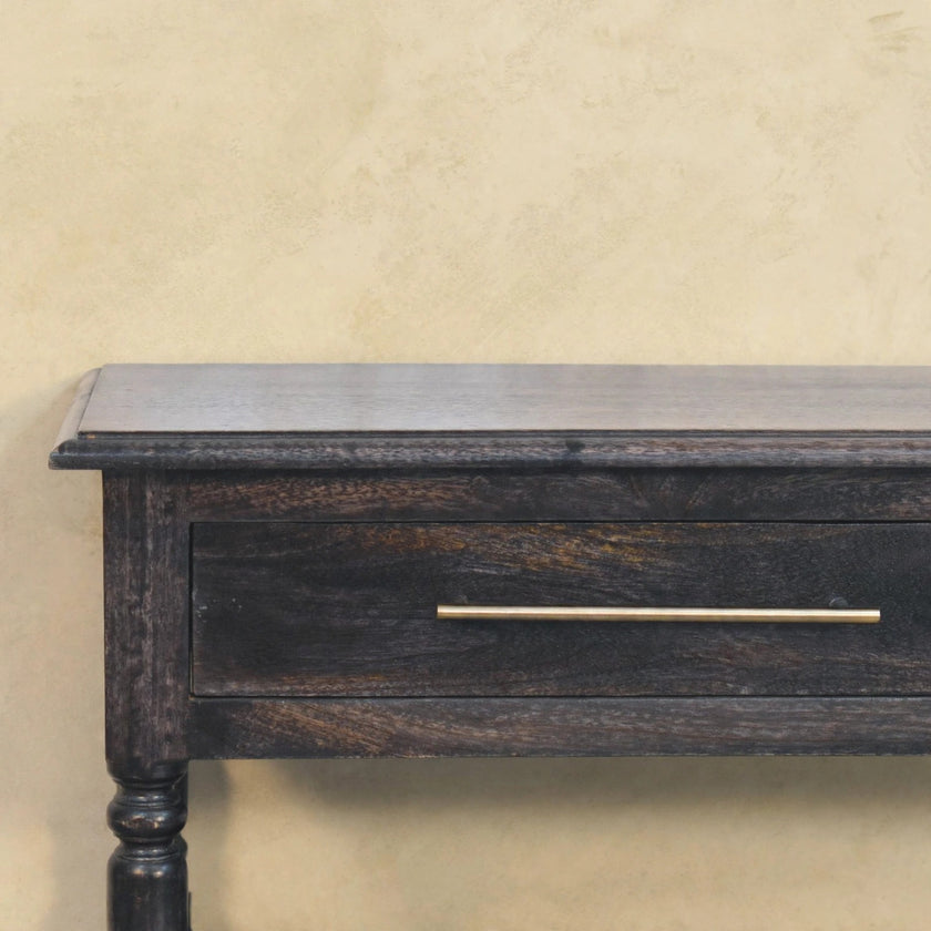 Front view of the side table showing the drawer with brass-finished handle